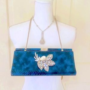 Iris Lane iridescent blue envelope clutch with crystal